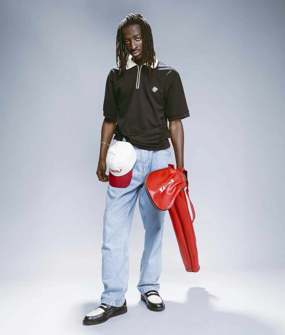 Polo negro con cremallera LE