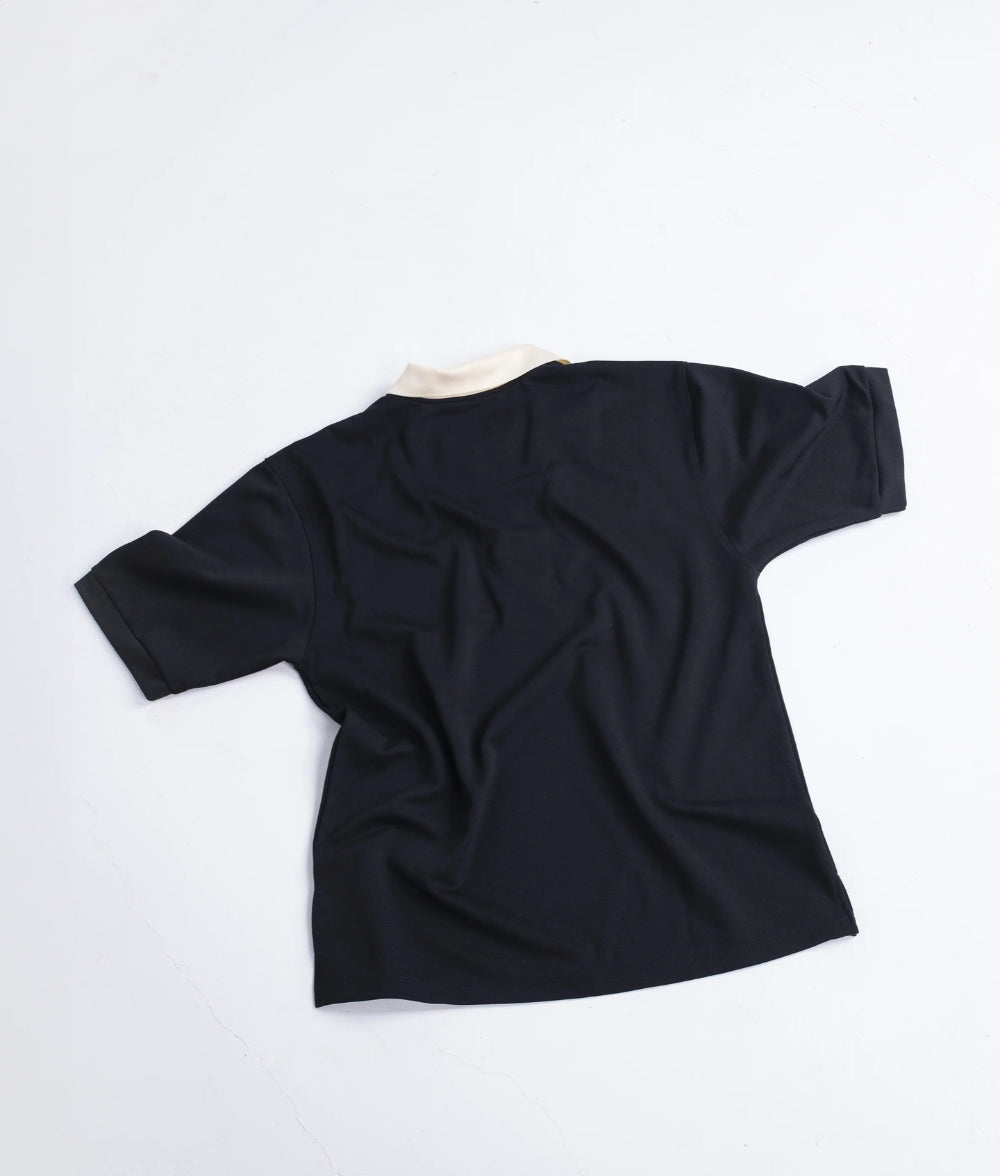 Polo negro con cremallera LE